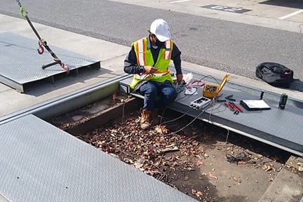Michelli technician documenting repair recommendations identified during a scale maintenance visit
