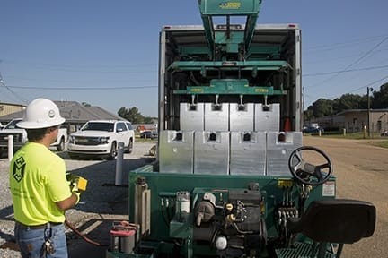 Michelli technician performing preventative maintenance on weighing equipment