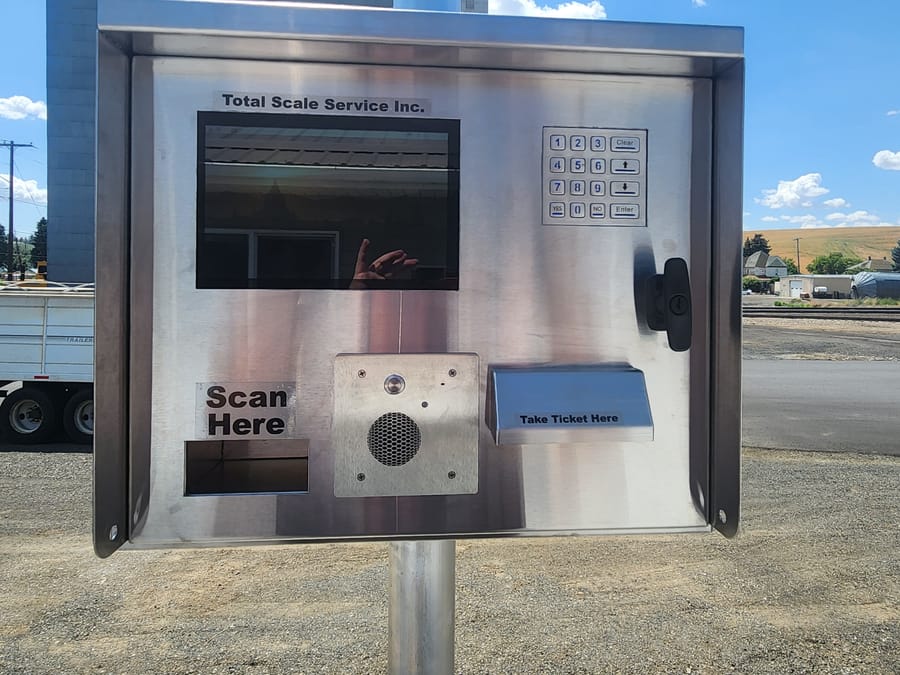 Outdoor unmanned scale service terminal with keypad, screen, and ticket slot