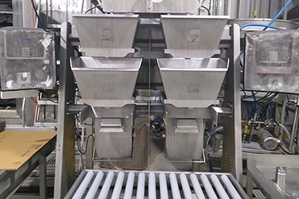 Belt scale system installed on an industrial conveyor measuring bulk material flow rate