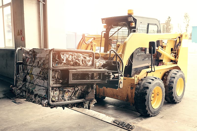 Michelli Weighing & Measurement technician servicing rugged scale equipment at a waste and recycling facility