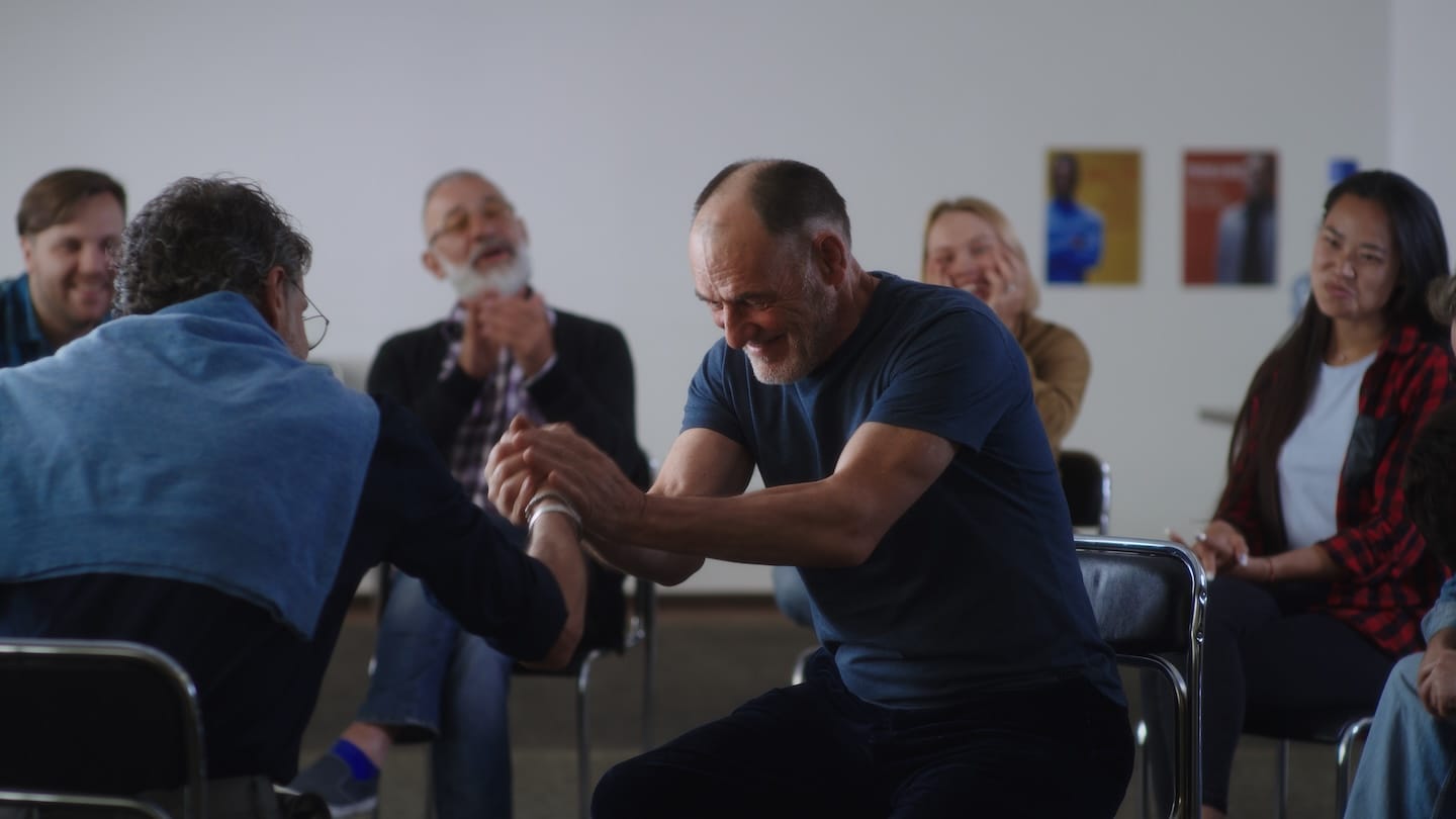A group therapy session with people sitting in a circle at AA Central Office Shreveport