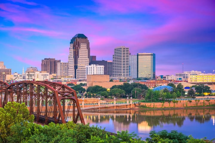 Downtown Shreveport Louisiana skyline at sunset reflecting on the Red River