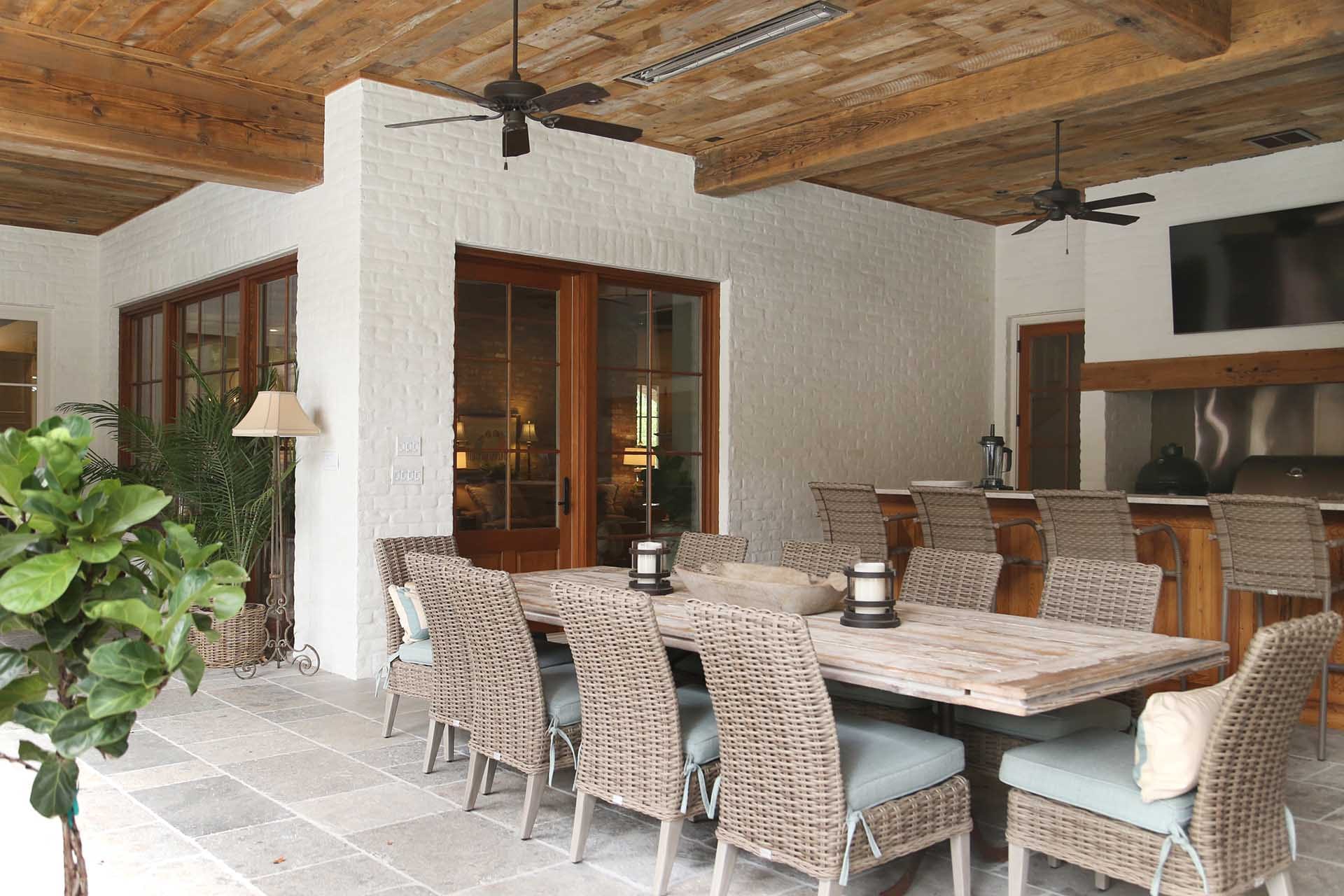 Outdoor kitchen and living space by The Cottage