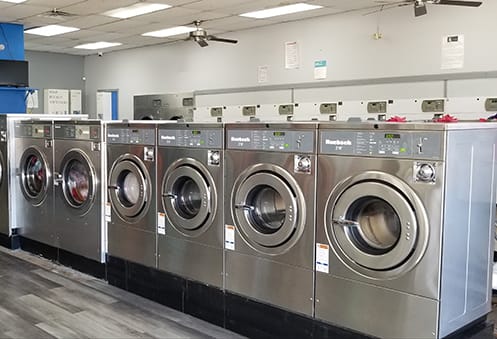 Rows of modern washing machines inside Entrum Laundry