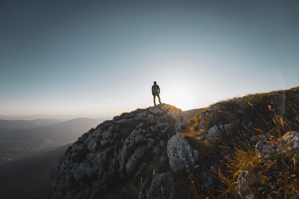 Person overlooking a mountain landscape
